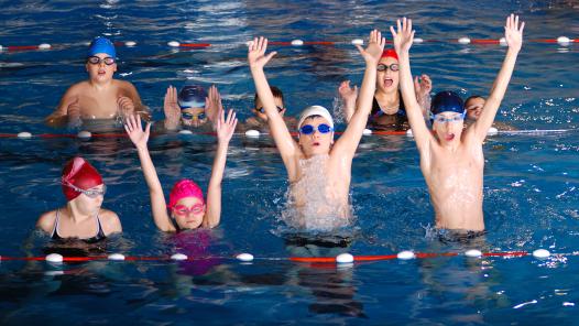 childrens-having-fun-swimming-pool