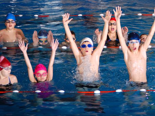 childrens-having-fun-swimming-pool
