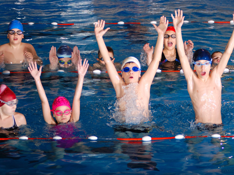 childrens-having-fun-swimming-pool